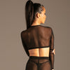 Sheer Mesh Top mit Kette Schwarz von KYNX: transparenter Rücken, Rückansicht am Model