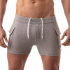 Graue verführerische Cargo Shorts mit maskulinem Schnitt von TOF Paris