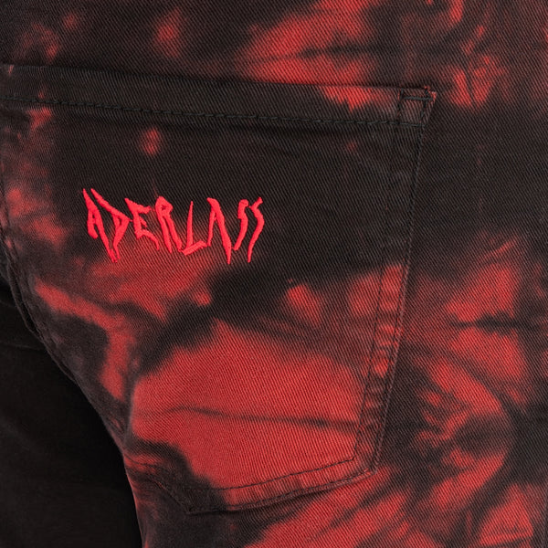 Asymmetrische Jeans mit Rot‑Schwarz‑Look | Aderlass